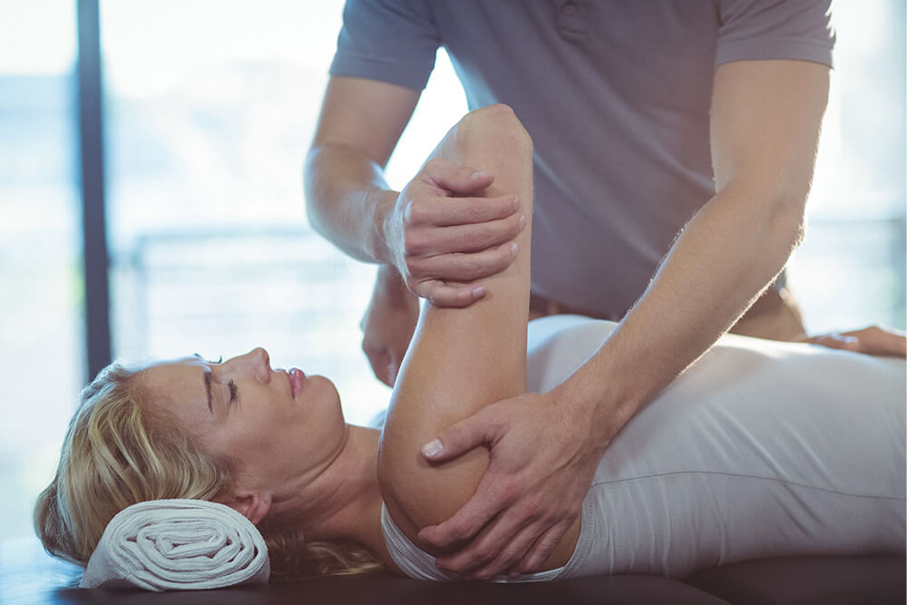 Chiropractor treating patient